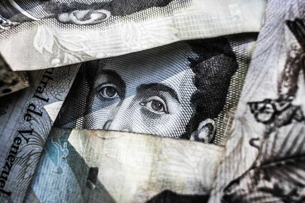 fast money stacking  bills on top of one another like investing